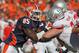 CHAMPAIGN, IL - OCTOBER 15: Whitney Mercilus #85 of the Illinois Fighting Illini rushes against Jack Mewhort #74 of the Ohio State Buckeyes at Memorial Stadium on October 15, 2011 in Champaign, Illinois. Ohio State defeated Illinois 17-7. (Photo by Jonathan Daniel/Getty Images)