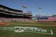 BOSTON, MA - APRIL 16: The flag covers the Green Monster as the national anthem is played before the game between the Boston Red Sox and the Tampa Bay Rays on April 16, 2012 at Fenway Park in Boston, Massachusetts. (Photo by Elsa/Getty Images)