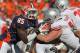 CHAMPAIGN, IL - OCTOBER 15: Whitney Mercilus #85 of the Illinois Fighting Illini rushes against Jack Mewhort #74 of the Ohio State Buckeyes at Memorial Stadium on October 15, 2011 in Champaign, Illinois. Ohio State defeated Illinois 17-7. (Photo by Jonathan Daniel/Getty Images)