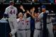 Jason Bay celebrates his first home run of the year with his New York Mets teammates.