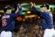Josh Willingham gets a high five for taking his Twinsbucks.