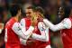 WIGAN, ENGLAND - DECEMBER 03: Thomas Vermaelen of Arsenal celebrates with Mikel Arteta and Gervinho after scoring the second goal during the Barclays Premier League match between Wigan Athletic and Arsenal at the DW Stadium on December 3, 2011 in Wigan, England. (Photo by Alex Livesey/Getty Images)