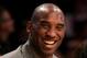 LOS ANGELES, CA - APRIL 13: Kobe Bryant #24 of the Los Angeles Lakers, in street clothes due to an injury, has a laugh on the bench during the game against the Denver Nuggets at Staples Center on April 13, 2012 in Los Angeles, California. The Lakers won 103-97. NOTE TO USER: User expressly acknowledges and agrees that, by downloading and or using this photograph, User is consenting to the terms and conditions of the Getty Images License Agreement. (Photo by Stephen Dunn/Getty Images)
