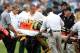 CHARLOTTE, NC - SEPTEMBER 18: Play is stoped as Nick Collins #36 of the Green Bay Packers is injured against the Carolina Panthers during their game at Bank of America Stadium on September 18, 2011 in Charlotte, North Carolina. (Photo by Streeter Lecka/Getty Images)