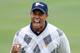 SAN FRANCISCO - OCTOBER 10: Tiger Woods of the USA Team celebrates his putt for a birdie to win the 17th hole during the Day Three Morning Foursome Matches of The Presidents Cup at Harding Park Golf Course on October 10, 2009 in San Francisco, California. (Photo by Harry How/Getty Images)