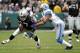 OAKLAND, CA - DECEMBER 18: Denarius Moore #17 of the Oakland Raiders gets tackled by Chris Houston #23 of the Detroit Lions at O.co Coliseum on December 18, 2011 in Oakland, California. (Photo by Thearon W. Henderson/Getty Images)