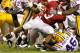 TUSCALOOSA, AL - NOVEMBER 05: Trent Richardson #3 of the Alabama Crimson Tide against Ryan Baker #22 and Kevin Minter #46 of the LSU Tigers at Bryant-Denny Stadium on November 5, 2011 in Tuscaloosa, Alabama. (Photo by Kevin C. Cox/Getty Images)