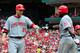 ST. LOUIS, MO - SEPTEMBER 3: Todd Frazier #21 of the Cincinnati Reds is congratulated by Brandon Phillips #4 after scoring a run against the St. Louis Cardinals at Busch Stadium on September 3, 2011 in St. Louis, Missouri. (Photo by Jeff Curry/Getty Images)