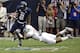 Robinson lunges to take down a Rice ball carrier.