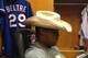 Howdy, pardner. Adrian Beltre dons Robbie Ross' hat during the Rangers' rain delay at Comerica Park Friday evening.