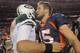 DENVER, CO - NOVEMBER 17: Quarterback Mark Sanchez #6 of the New York Jets and quarterback Tim Tebow #15 of the Denver Broncos meet at midfield after the Broncos defeated the Jets 17-13 at Sports Authority Field at Mile High on November 17, 2011 in Denver, Colorado. Tim Tebow scored the game winning touchdown with 58 seconds remaining in the game. (Photo by Doug Pensinger/Getty Images)