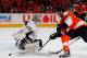 PHILADELPHIA, PA - APRIL 22: Goalie Marc-Andre Fleury #29 of the Pittsburgh Penguins just gets his stick on the puck to make a save on Claude Giroux #28 of the Philadelphia Flyers in the second period of Game Six of the Eastern Conference Quarterfinals during the 2012 NHL Stanley Cup Playoffs at Wells Fargo Center on April 22, 2012 in Philadelphia, Pennsylvania. (Photo by Paul Bereswill/Getty Images)