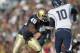 SOUTH BEND, IN - NOVEMBER 21: Darius Fleming #45 of the Notre Dame Fighting Irish moves to sacke quarterback Zach Frazer #10 of the Univeristy of Connecticut Huskies at Notre Dame Stadium on November 21, 2009 in South Bend, Indiana. (Photo by Jonathan Daniel/Getty Images)