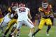 LOS ANGELES, CA - SEPTEMBER 10: Marc Tyler #26 of the USC Trojans looks for a block on Matt Martinez #52 of the Utah Utes during the fourth quarter at Los Angeles Memorial Coliseum on September 10, 2011 in Los Angeles, California. (Photo by Harry How/Getty Images)