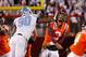 BLACKSBURG, VA - NOVEMBER 17: Logan Thomas #3 of the Virginia Tech Hokies is struck in the head after throwing the ball by Quinton Coples #90 of the North Carolina Tar Heels at Lane Stadium on November 17, 2011 in Blacksburg, Virginia. (Photo by Geoff Burke/Getty Images)
