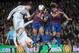 BARCELONA, SPAIN - APRIL 21: Cristiano Ronaldo (L) of Real Madrid CF heads the ball beside Carles Puyol (#5) of FC Barcelona during the La Liga match between FC Barcelona and Real Madrid CF at Camp Nou on April 21, 2012 in Barcelona, Spain. (Photo by Denis Doyle/Getty Images)