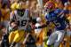 BATON ROUGE, LA - OCTOBER 08: Brandon Taylor #18 of the Louisiana State University Tigers avoids a tackle after an interception over Frankie Hammond #85 of the Florida Gators at Tiger Stadium on October 8, 2011 in Baton Rouge, Louisiana. The Tigers defeated the Gators 41-11. (Photo by Chris Graythen/Getty Images)