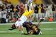 TEMPE, AZ - SEPTEMBER 24: Rhett Ellison #40 of the University of Southern California Trojans gets up ended after making a catch by Osahon Irabor #24 of the Arizona State Sun Devils at Sun Devil Stadium on September 24, 2011 in Tempe, Arizona. (Photo by Norm Hall/Getty Images)