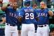 ARLINGTON, TX - APRIL 25: Adrian Beltre #29 celebrates his home run with Elvis Andrus #1, left and Yorvit Torrealba #8 of the Texas Rangers against the New York Yankees at Rangers Ballpark in Arlington on April 25, 2012 in Arlington, Texas. (Photo by Ronald Martinez/Getty Images)