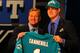 NEW YORK, NY - APRIL 26: Ryan Tannehill from Texas A&M holds up a jersey as he stands on stage with NFL Commissioner Roger Goodell after he was selected #8 overall by the Miami Dolphins in the first round of during the 2012 NFL Draft at Radio City Music Hall on April 26, 2012 in New York City. (Photo by Al Bello/Getty Images)