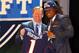NEW YORK, NY - APRIL 26: Dont'a Hightower of Alabama holds up a jersey as he stands on stage with NFL Commissioner Roger Goodell after he was selected #25 overall by the New England Patriots in the first round of the 2012 NFL Draft at Radio City Music Hall on April 26, 2012 in New York City. (Photo by Al Bello/Getty Images)
