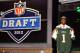 NEW YORK, NY - APRIL 26: Quinton Coples of North Carolina holds up a jersey as he stands on stage after he was selected #16 overall by the New York Jets in the first round of the 2012 NFL Draft at Radio City Music Hall on April 26, 2012 in New York City. (Photo by Al Bello/Getty Images)