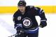 WINNIPEG, CANADA - MARCH 26: Kyle Wellwood #13 of the Winnipeg Jets skates down the ice during a game against the Ottawa Senators in NHL action at the MTS Centre on March 26, 2012 in Winnipeg, Manitoba, Canada. (Photo by Marianne Helm/Getty Images)