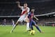 BARCELONA, SPAIN - NOVEMBER 29: David Villa of FC Barcelona (R) duels for the ball with Botelho of Rayo Vallecano during the La Liga match between FC Barcelona and Rayo Vallecano at Camp Nou on November 29, 2011 in Barcelona, Spain. (Photo by David Ramos/Getty Images)