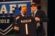 NEW YORK, NY - APRIL 26: Shea McClellin (R) of Boise State holds up a jersey as he stands on stage with NFL Commissioner Roger Goodell after he was selected #19 overall by the Chicago Bears in the first round of the 2012 NFL Draft at Radio City Music Hall on April 26, 2012 in New York City. (Photo by Al Bello/Getty Images)