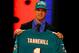 NEW YORK, NY - APRIL 26: Ryan Tannehill from Texas A&M holds up a jersey as he stands on stage after he was selected #8 overall by the Miami Dolphins in the first round of during the 2012 NFL Draft at Radio City Music Hall on April 26, 2012 in New York City. (Photo by Al Bello/Getty Images)