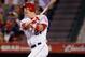 ANAHEIM, CA - SEPTEMBER 26: Mike Trout #27 of the Los Angeles Angels of Anaheim hits an RBI single against the Texas Rangers in the sixth inning at Angel Stadium of Anaheim on September 26, 2011 in Anaheim, California. The Rangers defeated the Angels 4-3. (Photo by Jeff Gross/Getty Images)