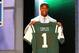 NEW YORK, NY - APRIL 26: Quinton Coples of North Carolina holds up a jersey as he stands on stage after he was selected #16 overall by the New York Jets in the first round of the 2012 NFL Draft at Radio City Music Hall on April 26, 2012 in New York City. (Photo by Al Bello/Getty Images)