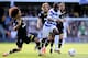 LONDON, ENGLAND - APRIL 21: Samba Diakite of QPR goes past the challenge from Benoit Assou-Ekotto of Spurs during the Barclays Premier League match between Queens Park Rangers and Tottenham Hotspur at Loftus Road on April 21, 2012 in London, England. (Photo by Shaun Botterill/Getty Images)