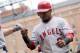 BALTIMORE, MD - SEPTEMBER 18: Erick Aybar #2 of the Los Angeles Angels of Anaheim bumps fists with teammates after scoring on a double by Bobby Abreu (not pictured) in the first inning of a baseball game against the Baltimore Orioles at Oriole Park at Camden Yards on September 18, 2011 in Baltimore, Maryland. The Angels beat the Orioles 11-2. (Photo by Steve Ruark/Getty Images)