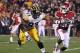 TEMPE, AZ - DECEMBER 30: Runningback Roy Finch #22 of the Oklahoma Sooners rushes the football against defensive lineman Mike Daniels #93 of the Iowa Hawkeyes during the Insight Bowl at Sun Devil Stadium on December 30, 2011 in Tempe, Arizona. (Photo by Christian Petersen/Getty Images)
