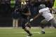 SEATTLE - NOVEMBER 05: Running back Chris Polk #1 of the Washington Huskies rushes against Michael Clay #46 of the Oregon Ducks on November 5, 2011 at Husky Stadium in Seattle, Washington. Oregon won 34-17. (Photo by Otto Greule Jr/Getty Images)
