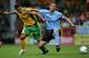NORWICH, UNITED KINGDOM - AUGUST 08: Youssef Safri of Norwich tackles Graham Alexander of Preston during the Coca-Cola Championship match between Norwich City and Preston North End at Carrow Road on August 8, 2006 in Norwich, England. (Photo by Jamie McDonald/Getty Images)