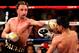 NEW YORK - MAY 15: Amir Khan (L) of Great Britain hits Paulie Malignaggi during the WBA light welterweight title fight at Madison Square Garden on May 15, 2010 in New York City. (Photo by Chris Trotman/Getty Images)