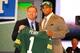 NEW YORK, NY - APRIL 26: Nick Perry (R) from USC holds up a jersey as he stands on stage with NFL Commissioner Roger Goodell after he was selected #28 overall by the Green Bay Packers in the first round of the 2012 NFL Draft at Radio City Music Hall on April 26, 2012 in New York City. (Photo by Al Bello/Getty Images)