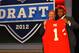 NEW YORK, NY - APRIL 26: Dontari Poe of Memphis holds up a jersey as he stands on stage with NFL Commissioner Roger Goodell after he was selected #11 overall by the Kansas City Chiefs in the first round of the 2012 NFL Draft at Radio City Music Hall on April 26, 2012 in New York City. (Photo by Al Bello/Getty Images)