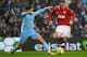 MANCHESTER, ENGLAND - JANUARY 08: Samir Nasri of Manchester City challenges Wayne Rooney of Manchester United during the FA Cup Third Round match between Manchester City and Manchester United at the Etihad Stadium on January 8, 2012 in Manchester, England. (Photo by Alex Livesey/Getty Images)