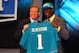 NEW YORK, NY - APRIL 26: Justin Blackmon (R) from Oklahoma State holds up a jersey as he stands on stage with NFL Commissioner Roger Goodell after he was selected #5 overall by the Jacksonville Jaguars in the first round of the 2012 NFL Draft at Radio City Music Hall on April 26, 2012 in New York City. (Photo by Al Bello/Getty Images)