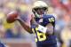 ANN ARBOR, MI - NOVEMBER 26: Denard Robinson #16 of the Michigan Wolverines throws a first quarter touchdown while playing the Ohio State Buckeyes at Michigan Stadium on November 26, 2011 in Ann Arbor, Michigan. (Photo by Gregory Shamus/Getty Images)
