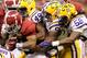 NEW ORLEANS, LA - JANUARY 09: Trent Richardson #3 of the Alabama Crimson Tide gets tackled by Ryan Baker #22, Barkevious Mingo #49 and Michael Brockers #90 of the Louisiana State University Tigers during the 2012 Allstate BCS National Championship Game at Mercedes-Benz Superdome on January 9, 2012 in New Orleans, Louisiana. (Photo by Andy Lyons/Getty Images)