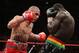 NEW YORK - JUNE 13: Miguel Cotto punches Joshua Clottey during their WBO Welterweight title fight at Madison Square Garden on June 13, 2009 in New York, New York. (Photo by Al Bello/Getty Images)