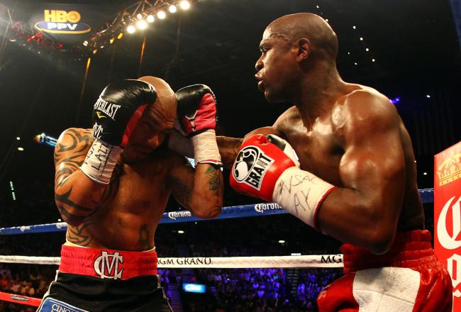 Mayweather smokes Cotto with a right.