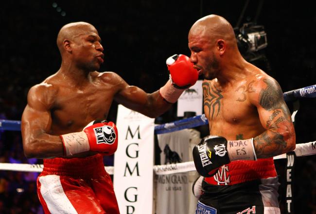 Mayweather smacks Cotto and began taking over in the championship rounds.