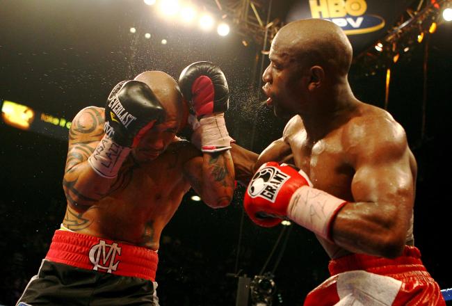 Mayweather was challenged and fought back-and put on a strong show.