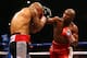 LAS VEGAS, NV - MAY 05: (R-L) Floyd Mayweather Jr. throws a right to the head of Miguel Cotto during their WBA super welterweight title fight at the MGM Grand Garden Arena on May 5, 2012 in Las Vegas, Nevada. (Photo by Al Bello/Getty Images)
