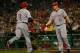 PITTSBURGH - AUGUST 19: Joey Votto #19 of the Cincinnati Reds is congratulated by teammate Jay Bruce #32 after hitting a two-run home run against the Pittsburgh Pirates during the game on August 19, 2011 at PNC Park in Pittsburgh, Pennsylvania. (Photo by Jared Wickerham/Getty Images)